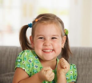 portrait of excited little girl (3-4 years) at home.