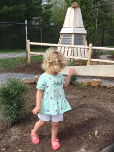 Girl on natural playground