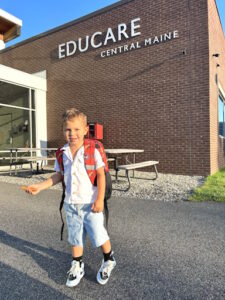 Young boy in front of Educare Central Maine building